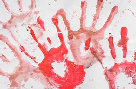 woman red tone hand print on a white paper pattern backgroundの写真素材