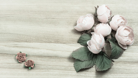 old flowers deco on wooden pattern background with retro filterの写真素材