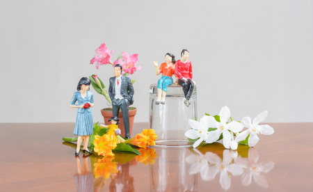 miniature family people with a flower  concept resting dayの写真素材