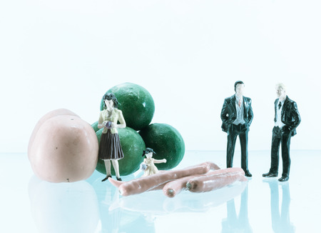 vegetable tomatoes, lemon and pepper with business and family miniature with retro filterの写真素材