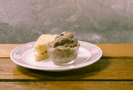 banana cake with chocolate cream on table with retro filterの写真素材