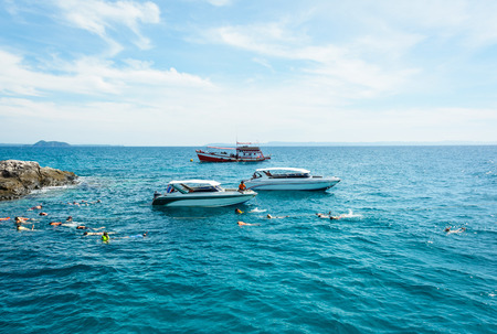 motor speed boat on sea with tourist relax diving at summer dayの写真素材