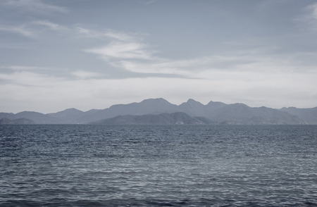 view sea scape natural and mountain range with retro filterの写真素材