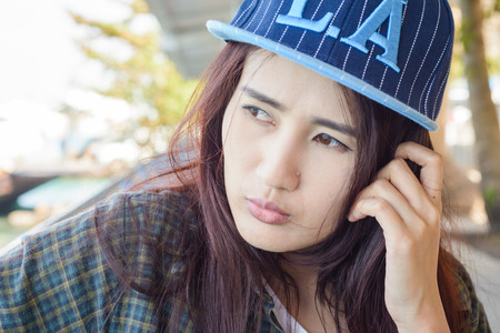 Outdoors portrait of young asia girl. at natural backgroundの写真素材