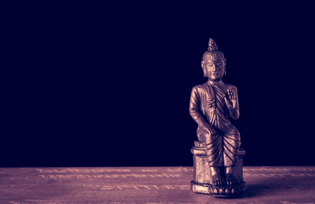 close up small buddha amulets of Buddhism religion with retro filterの写真素材