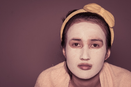 face asia girl treatment blue facial mask with retro filterの写真素材