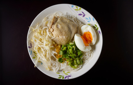 top view fried rice noodles with vegetables, boiled egg and chicken meat