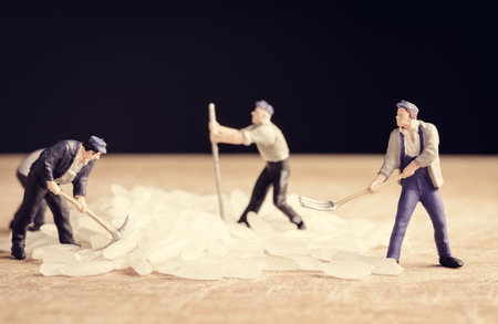close up Miniature worker man amd rice seed food with retro filterの写真素材
