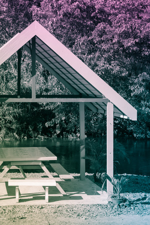 table outdoor at natural river side in forest with retro filterの写真素材