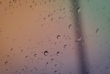 rain water drops on glass background with retro filterの写真素材
