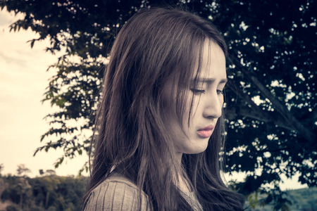 portrait asia girl on forest natural with retro filterの写真素材