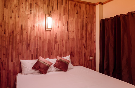 night time white bedding and pillow with retro filterの写真素材