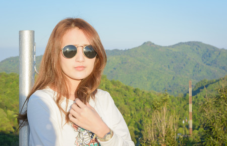 portrait woman relax and standing on top of mountainの写真素材