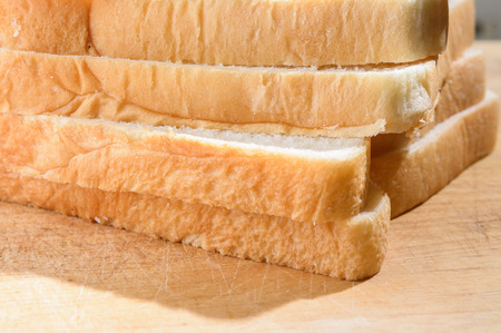 close up sliced bread on wood pattern (thai bread)