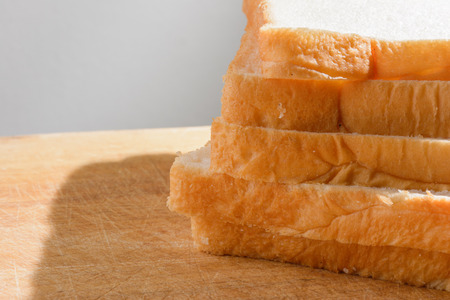 close up sliced bread on wood pattern (thai bread)