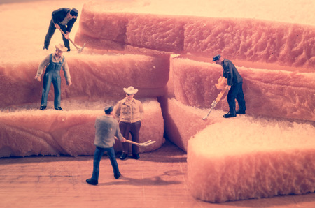 miniature people worker on sliced bread (work on bread) with retro filterの写真素材