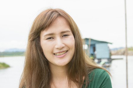 young girl on natural river outdoor (asia girl)の写真素材