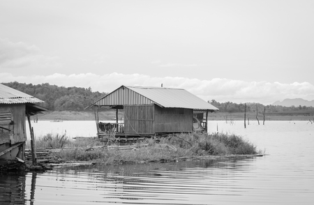 river water natural on dam with raft home with retro filterの写真素材
