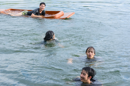 man swimming in oceans water natural (asia man)の写真素材