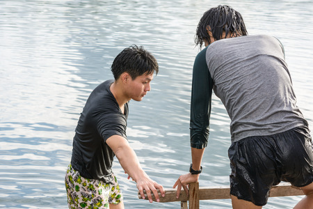 man relaxing on water natural dam at outdoor  (asia man)の写真素材