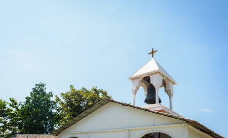 old bell tower on roof public church thailandの写真素材