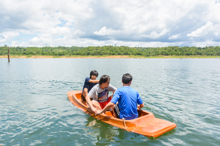 asia men driving with kayak on natural forest river (water sport)の写真素材