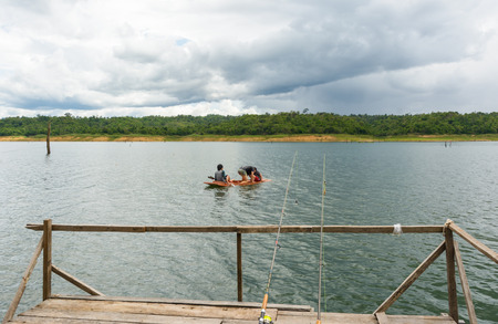 river water natural and forest tree on dam with fishing raftの写真素材
