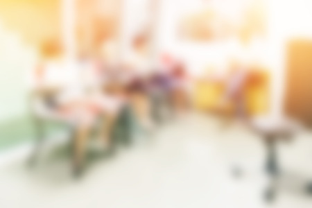 blurred background of child learning education in class room with teacherの写真素材