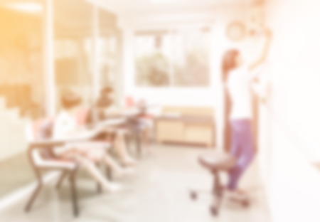 blurred background of student class child learning education in class room with teacherの写真素材