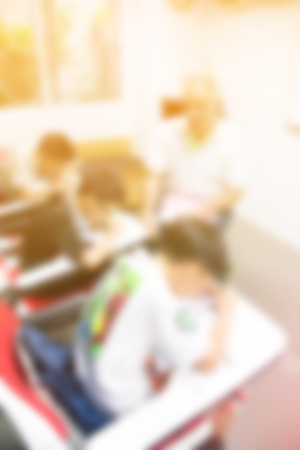 blurred background of student class child learning education in class room with teacherの写真素材