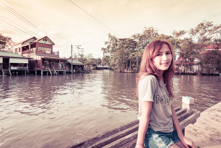 woman relax on natural river water with vintage filter effectの写真素材