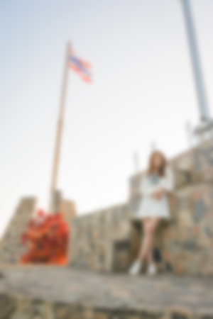 blur background of people woman at outdoor with flag pole thailandの写真素材