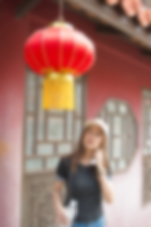 blur background of people travel man in home asia chinese style indoor.の写真素材