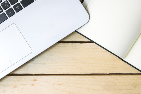 Keyboard With Book on wood backgroundの写真素材