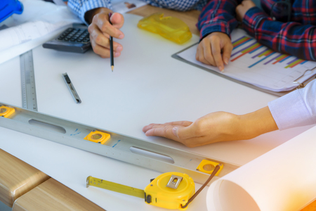 Close up Architects Hands Working with Engineering on blueprint backgroundの写真素材