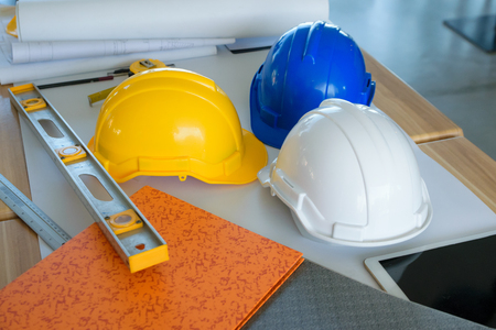 Architects Working with Engineering on workplace blueprint backgroundの写真素材