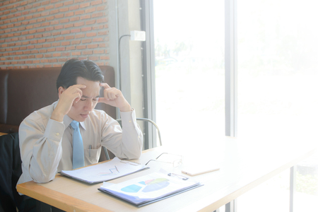 concept business Stressed about work on workplace in coffee shopの写真素材
