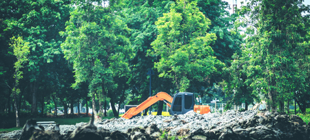 Yellow Excavator in Gardenの写真素材