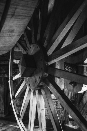 Old wooden water wheel in black and white, close-up.の写真素材