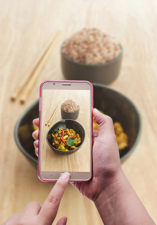 Image of shooting photographs with smartphone on asia foodの写真素材