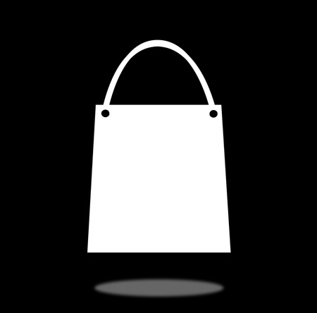 White shopping bag isolated on blackgroundの写真素材