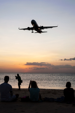 People with plane and color of sunset in twilight and dark tone