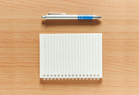 Notepad with A pen on office table