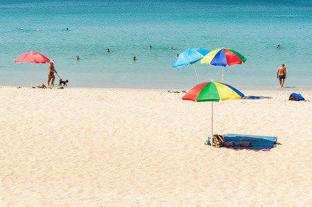 Phuket,Thailand - March 01, 2016: Some people relax on the white sand beach and blue sea with blue sky backgroundのeditorial素材