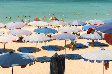 Phuket,Thailand - March 01, 2016: Parasol and some people relax on the white sand beach and blue sea with blue sky backgroundのeditorial素材