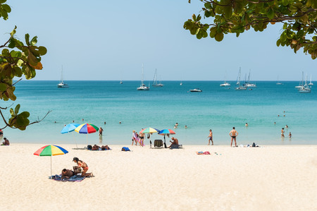 Phuket,Thailand - March 01, 2016: Some people relax on the white sand beach and blue sea with blue sky backgroundのeditorial素材