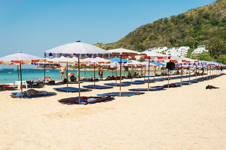 Phuket,Thailand - March 01, 2016: Parasol and some people relax on the white sand beach and blue sea with blue sky backgroundのeditorial素材