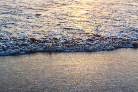 Beach sunset with color of sunlight on the sand in twilight, Pattern of water in the sea and sand...