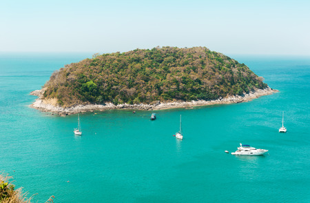 Sea turquoise with island and blue skyの写真素材