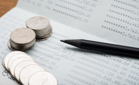Stack of coins with account bank or passbook for finance and banking concept, Save money and finance conceptの写真素材